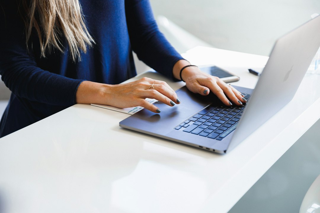Designer working on a website on a laptop