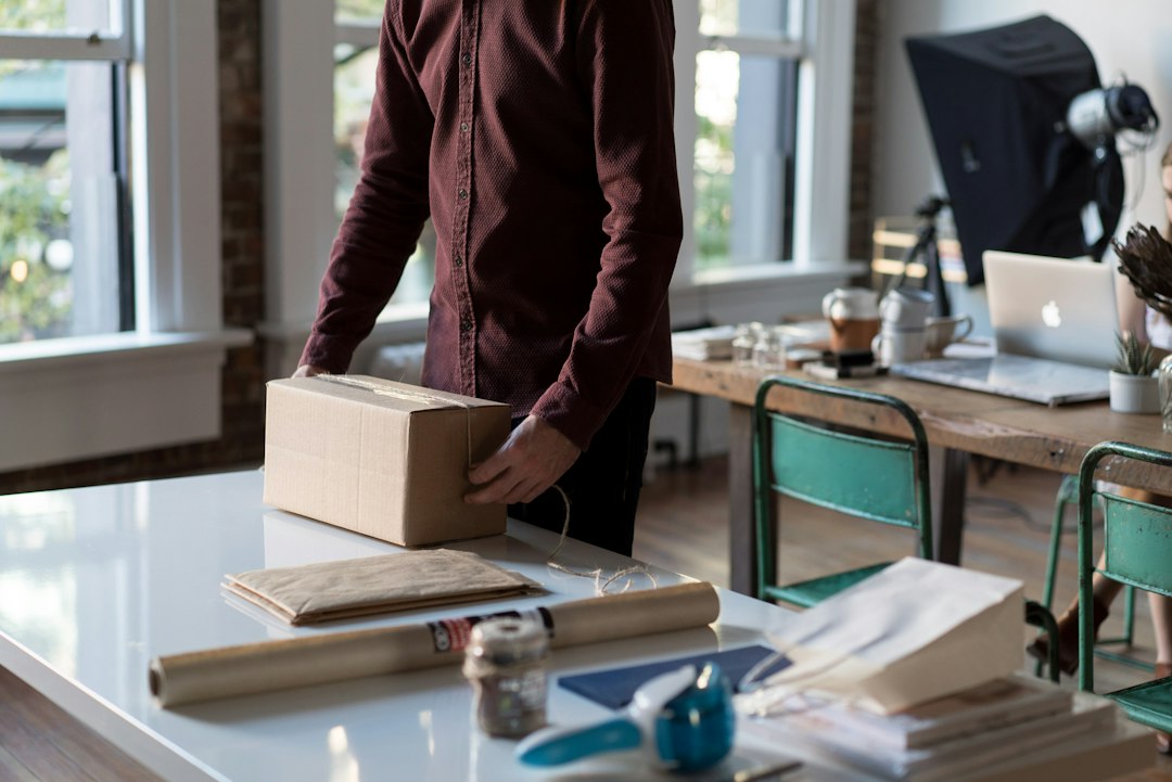 Person packing an online order into a box