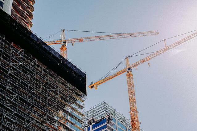 Construction site with cranes and scaffolding